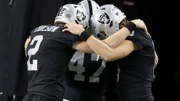 LAS VEGAS, NEVADA - JANUARY 09: Kicker Daniel Carlson #2, long snapper Trent Sieg #47 and punter A.J. Cole #6 of the Las Vegas Raiders get ready to take the field for their game against the Los Angeles Chargers at Allegiant Stadium on January 9, 2022 in L